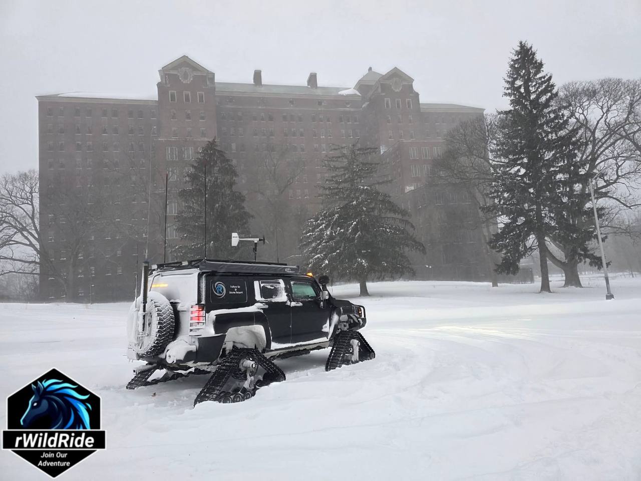 Tracked storm-chasing truck operating in heavy snow